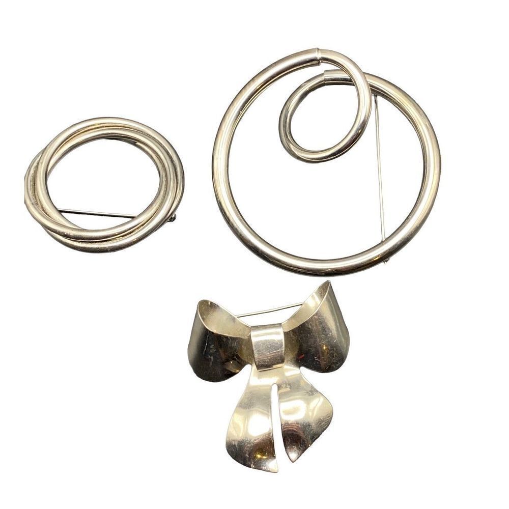Set of three retro silver tone pins two for scarves one large bow pin